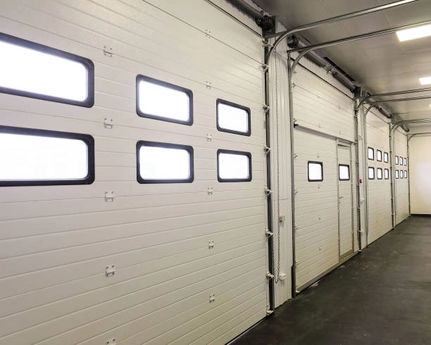 white garage doors indoor view with lights inside -repair garage door