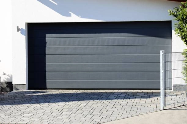 outdoor view of garage with grey door -cost for garage door installation