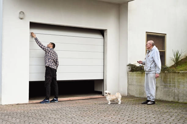 outdoor view of garage door with 2 person and a dog -cost for garage door installation