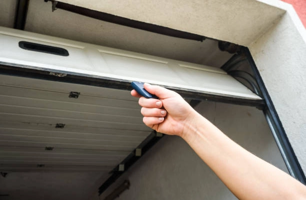 hand pulling garage door -garage door opener installation cost