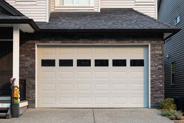 white garage door outdoor view with bricked wall, back bricked roof -garage door repair cost