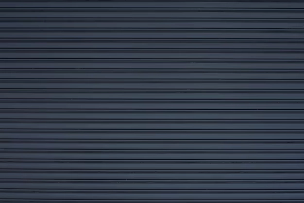 Dark horizontal slatted garage door with a sleek, modern design. -garage door covers